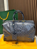 Goyard duffel bag, dark blue monogram canvas, two top handles, zip closure.