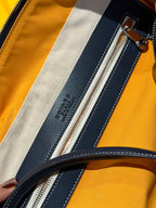 Goyard duffel bag interior zip pocket, dark blue lining with stitched trim stripe.