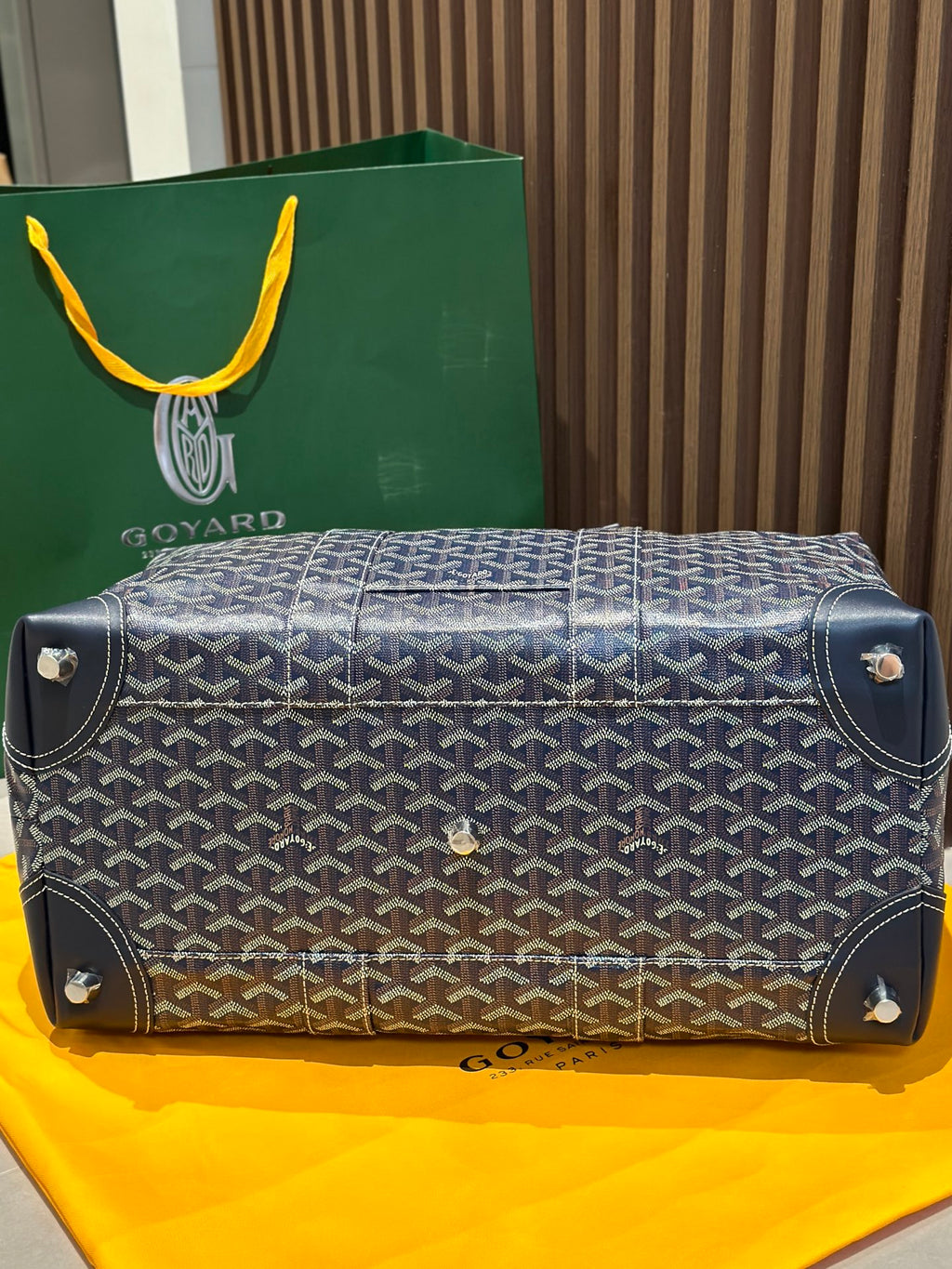 Goyard duffel bag base with corner studs, dark blue monogram canvas and leather trim.
