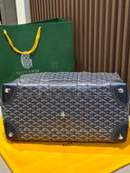 Goyard duffel bag base with corner studs, dark blue monogram canvas and leather trim.