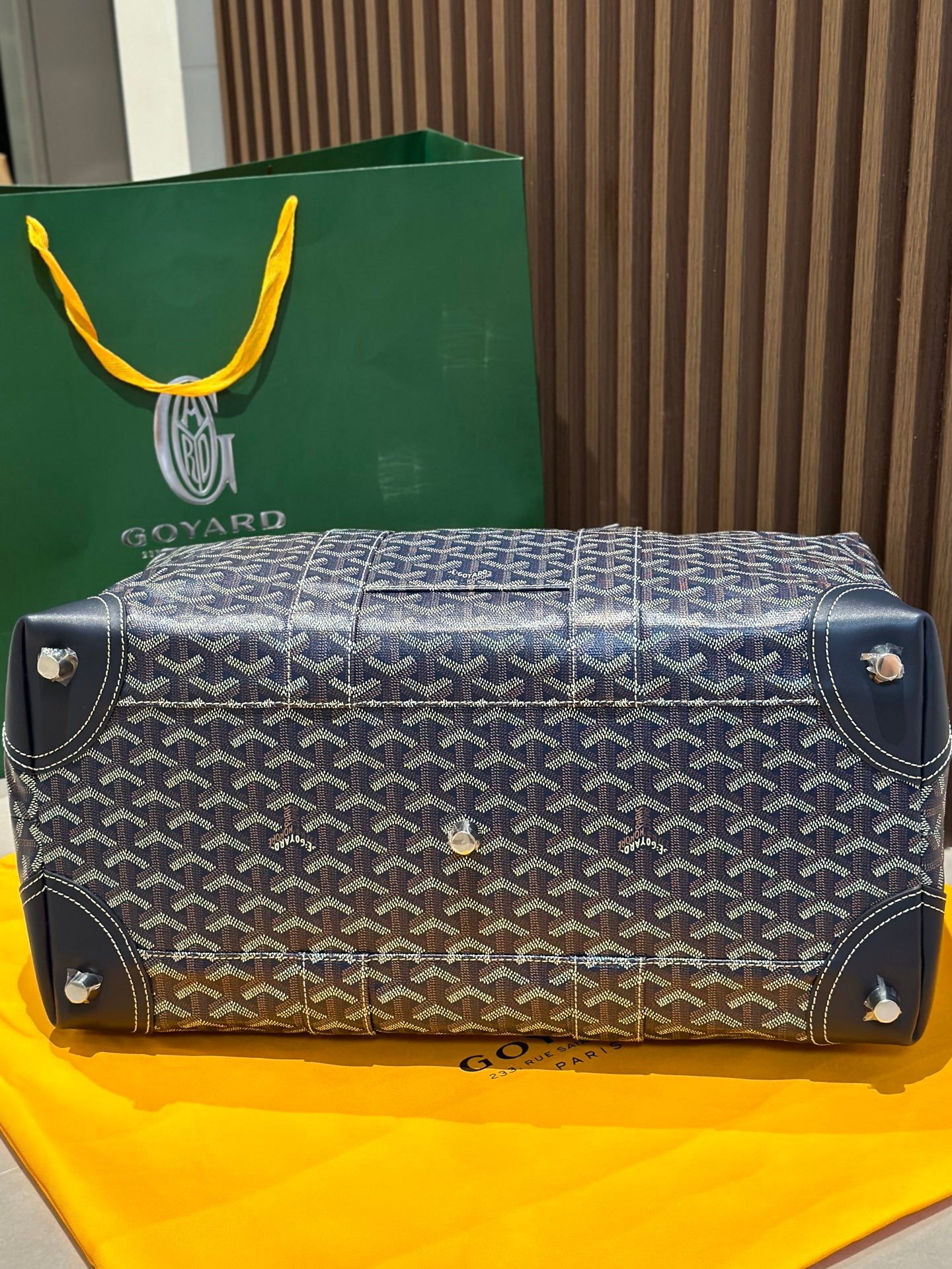 Goyard duffel bag base with corner studs, dark blue monogram canvas and leather trim.