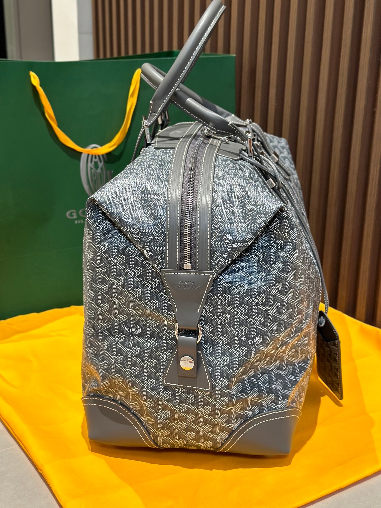 Goyard monogram backpack-duffel style bag in light gray with front pocket tab