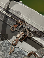 Goyard duffel bag zipper with silver hardware and patterned trim detail