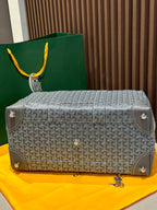 Goyard monogram duffel bag in light gray with shoulder strap and corner tabs
