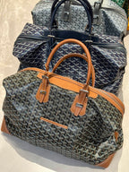 Goyard patterned tote bag with tan leather handles and trim, structured top