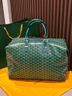 Green patterned duffel bag with top handles and structured front panel