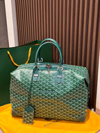 Goyard green patterned duffel bag with top handles and front zipper pockets