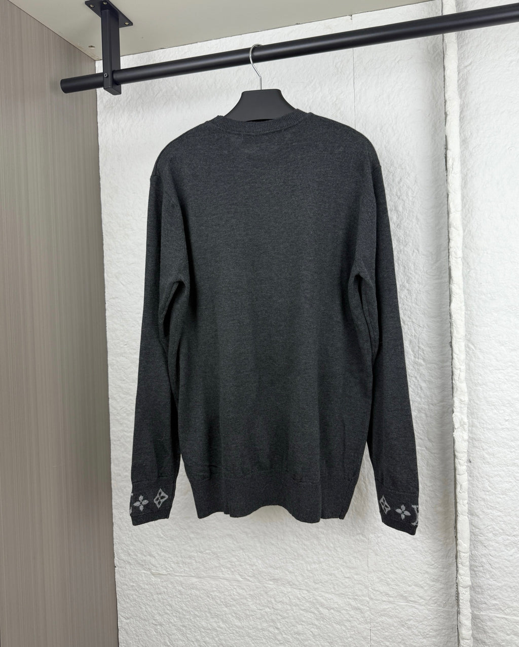 Louis Vuitton long-sleeve sweater, dark gray back view with monogram cuff accents