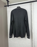 Louis Vuitton long-sleeve sweater, dark gray back view with monogram cuff accents