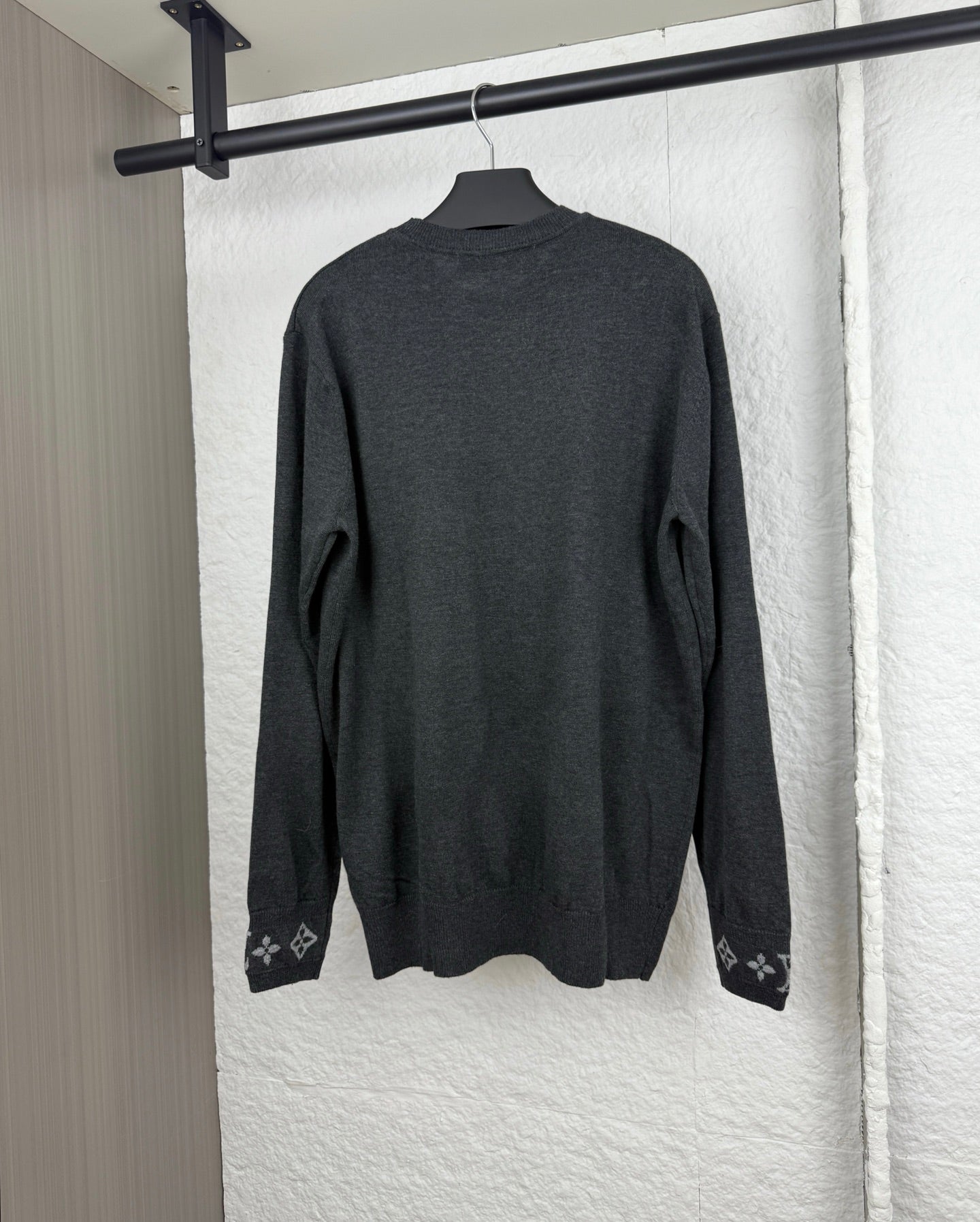 Louis Vuitton long-sleeve sweater, dark gray back view with monogram cuff accents