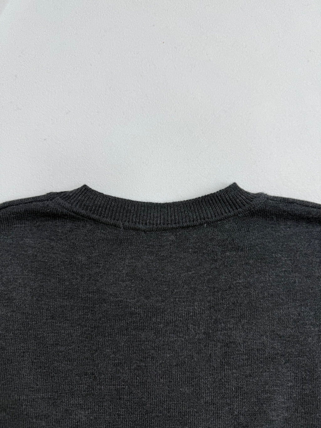 Dark gray crewneck sweater collar ribbing, neckline detail