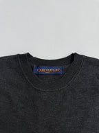 Louis Vuitton crewneck sweater neckline with brand label on dark gray knit
