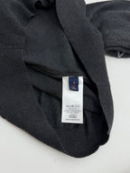 Dark gray sweater care label inside neckline area with Louis Vuitton tag
