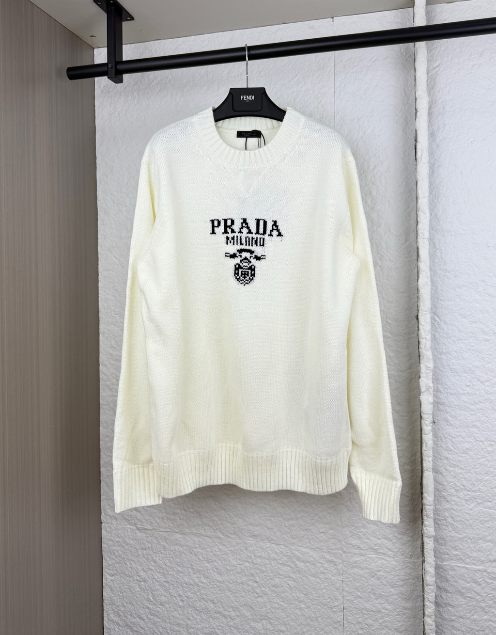 Long-sleeve knit sweater in pale yellow with PRADA Milano crest graphic on chest