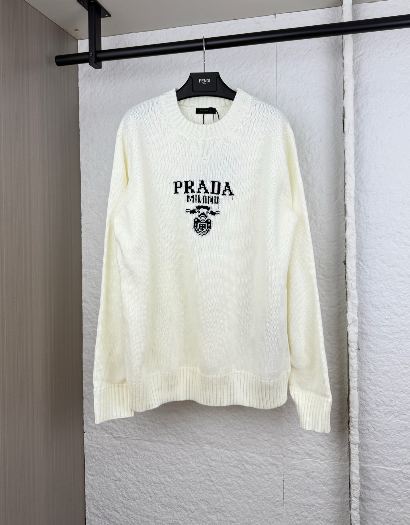 Long-sleeve knit sweater in pale yellow with PRADA Milano crest graphic on chest