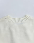 Back view of long-sleeve knit sweater with ribbed crew neckline in pale yellow