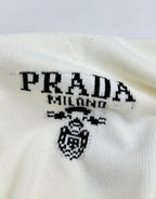 PRADA Milano logo graphic and crest on pale knit sweater front