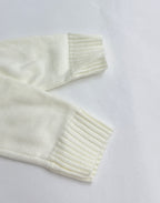 Long-sleeve knit sweater sleeve and ribbed cuff in pale yellow
