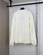 Long-sleeve knit sweater in pale yellow, crew neck with ribbed cuffs and hem