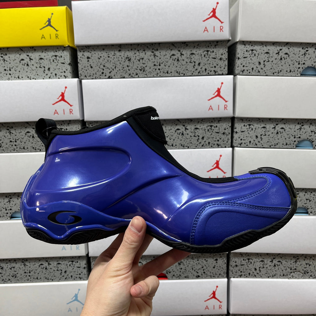 Balenciaga unisex sneakers side view, glossy blue upper with black heel tab and sole