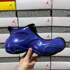 Balenciaga unisex sneakers side view, glossy blue upper with black heel tab and sole