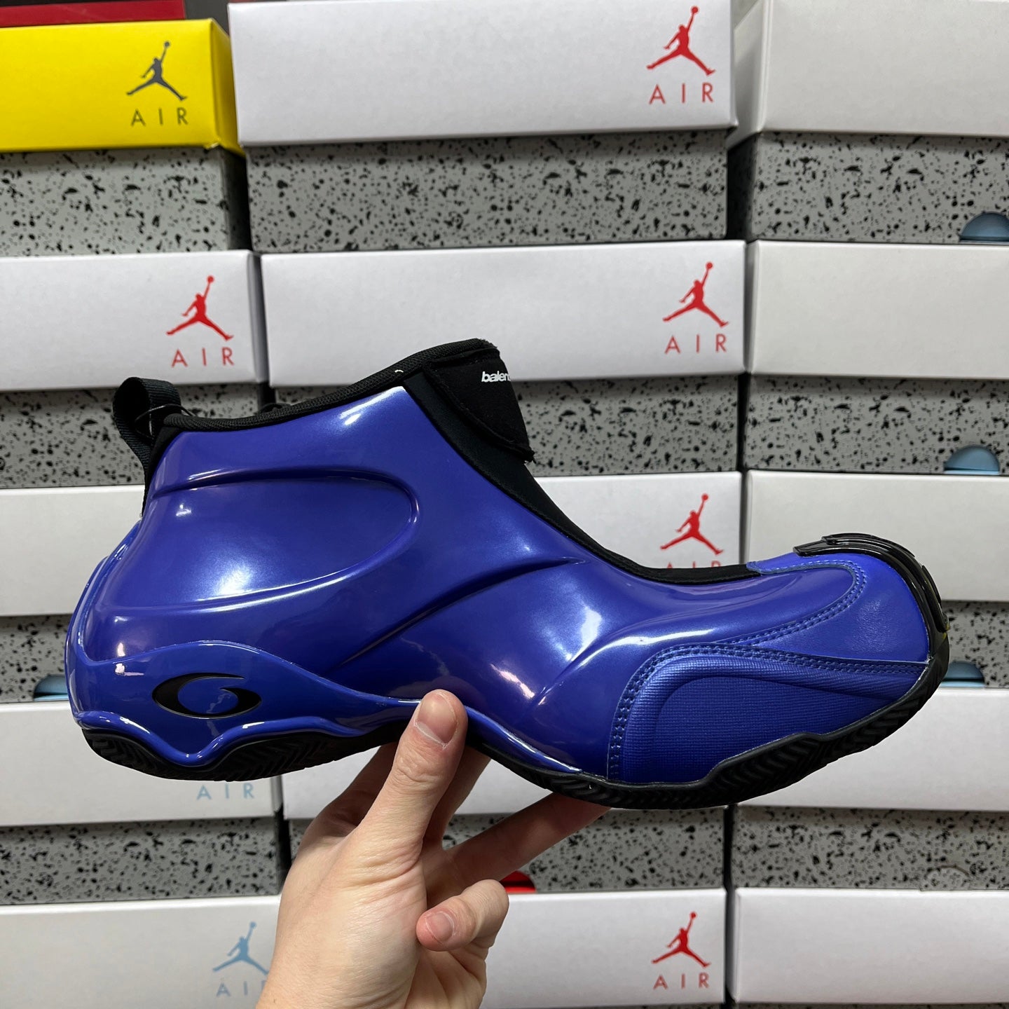 Balenciaga unisex sneakers side view, glossy blue upper with black heel tab and sole
