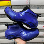 Balenciaga unisex sneaker pair, glossy blue uppers with black sock collars and tread soles