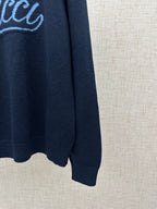 Navy knit sweater sleeve with ribbed cuff and curved hem