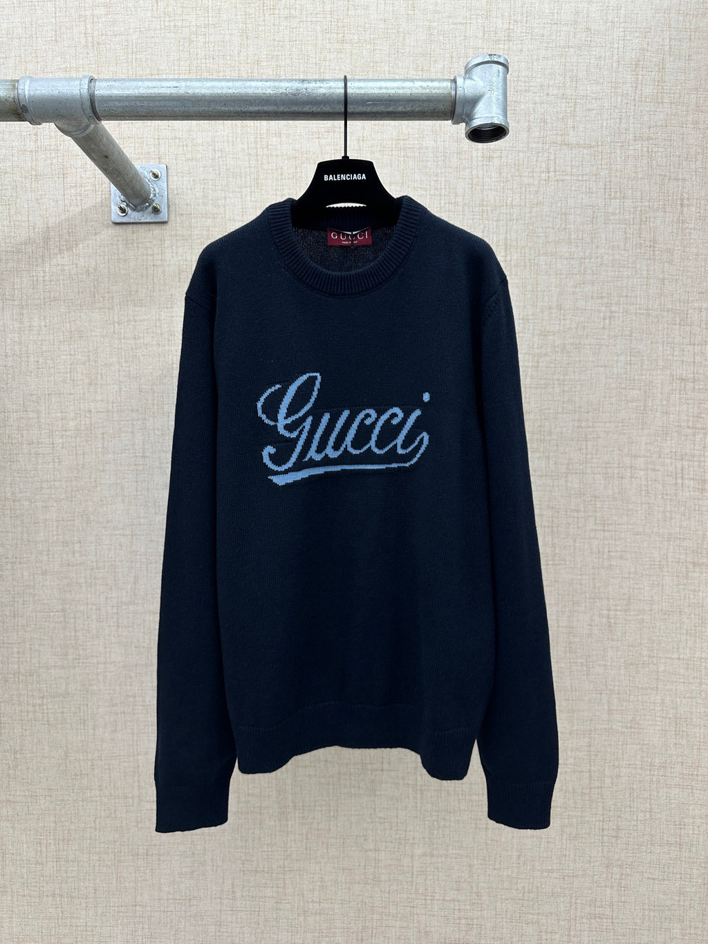 Navy knit sweater with 'Gucci' script logo and ribbed crew neckline