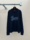 Navy knit sweater with 'Gucci' script logo and ribbed crew neckline