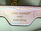 Louis Vuitton handbag label area showing "Louis Vuitton Paris" and "made in Italy"