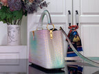 Louis Vuitton handbag with croc-embossed pastel finish, top handles and shoulder strap