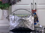 Louis Vuitton metallic silver handbag with monogram pattern, top handles, and shoulder strap