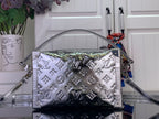 Louis Vuitton silver monogram handbag front view with top handles and crossbody strap