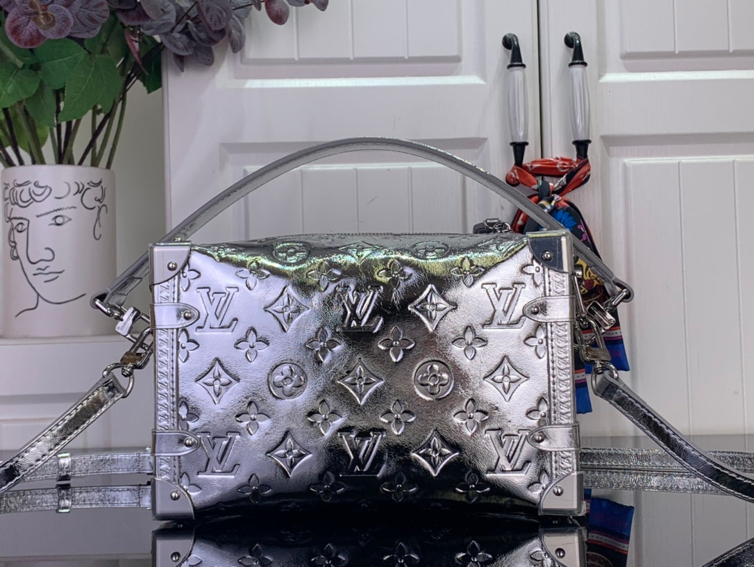 Louis Vuitton silver monogram handbag front view with top handles and crossbody strap