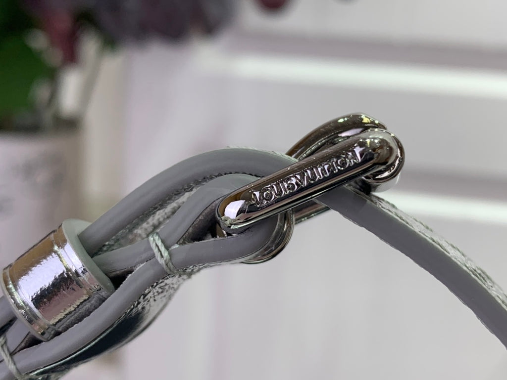 Louis Vuitton silver bag hardware with clasp and ring on textured monogram leather