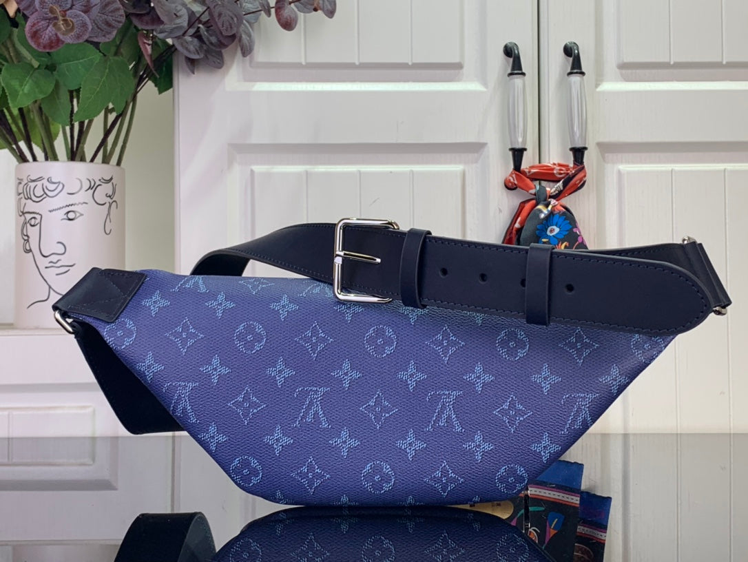 Blue monogram belt bag with wide strap and metal rectangular buckle