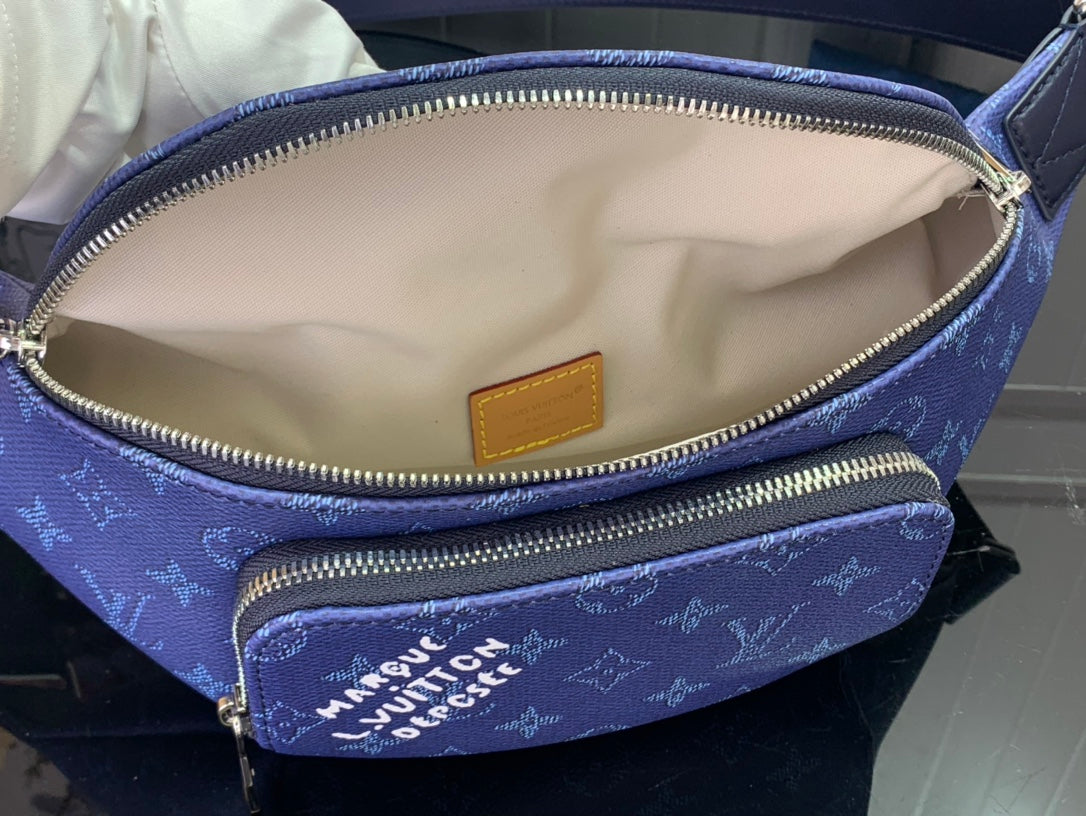 Blue monogram belt bag interior with zip pocket and tan leather logo patch
