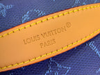 Tan interior label with Louis Vuitton Paris text and yellow edge stitching