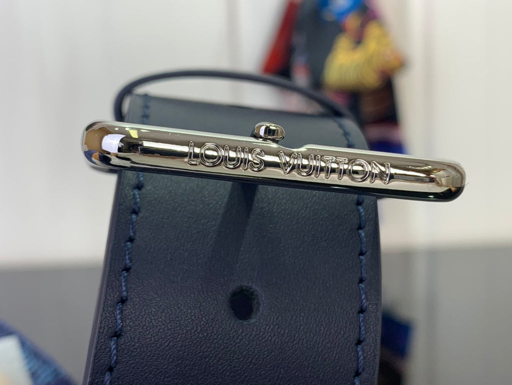 Blue belt bag with silver-tone logo bar hardware on front pocket