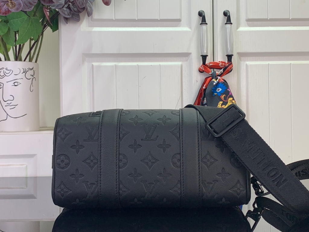 Men's Louis Vuitton monogram duffel bag with crossbody strap and buckle