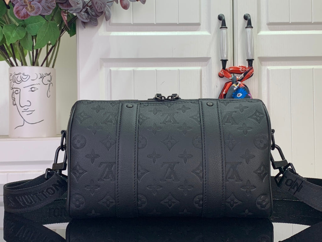 Men's Louis Vuitton monogram duffel bag with zip top and side straps