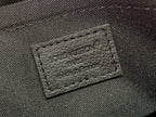 Louis Vuitton PARIS leather brand patch on dark fabric bag