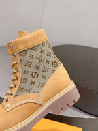 Tan lace-up ankle boots with monogram canvas side panel and padded ankle collar