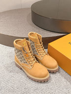 Tan lace-up ankle boots with monogram side panels and padded high collar