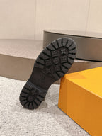 Louis Vuitton unisex black boot outsole with deep rubber tread, logo detail