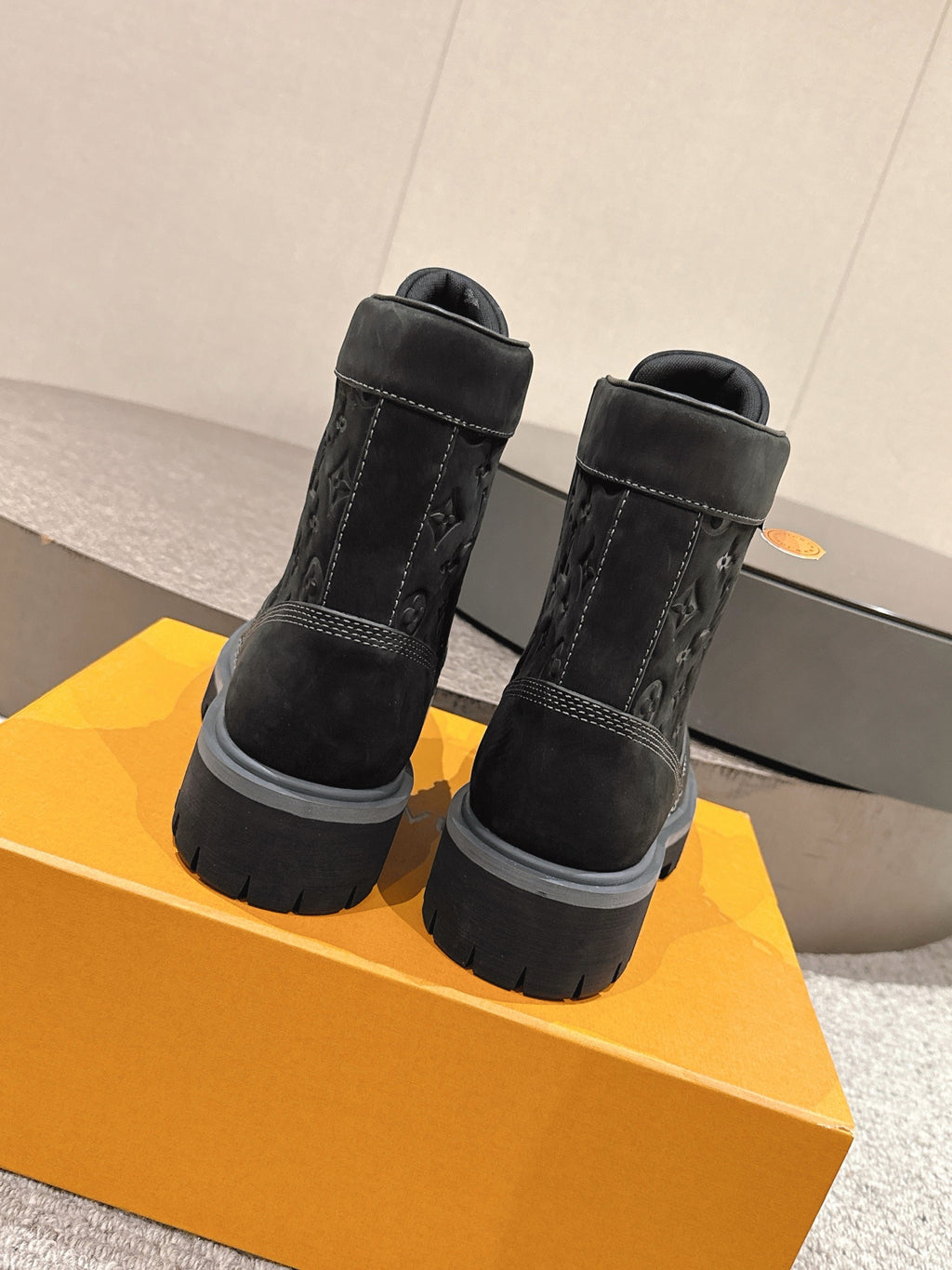 Louis Vuitton unisex black high-top boots, heel-back view, lace-up, chunky rubber sole