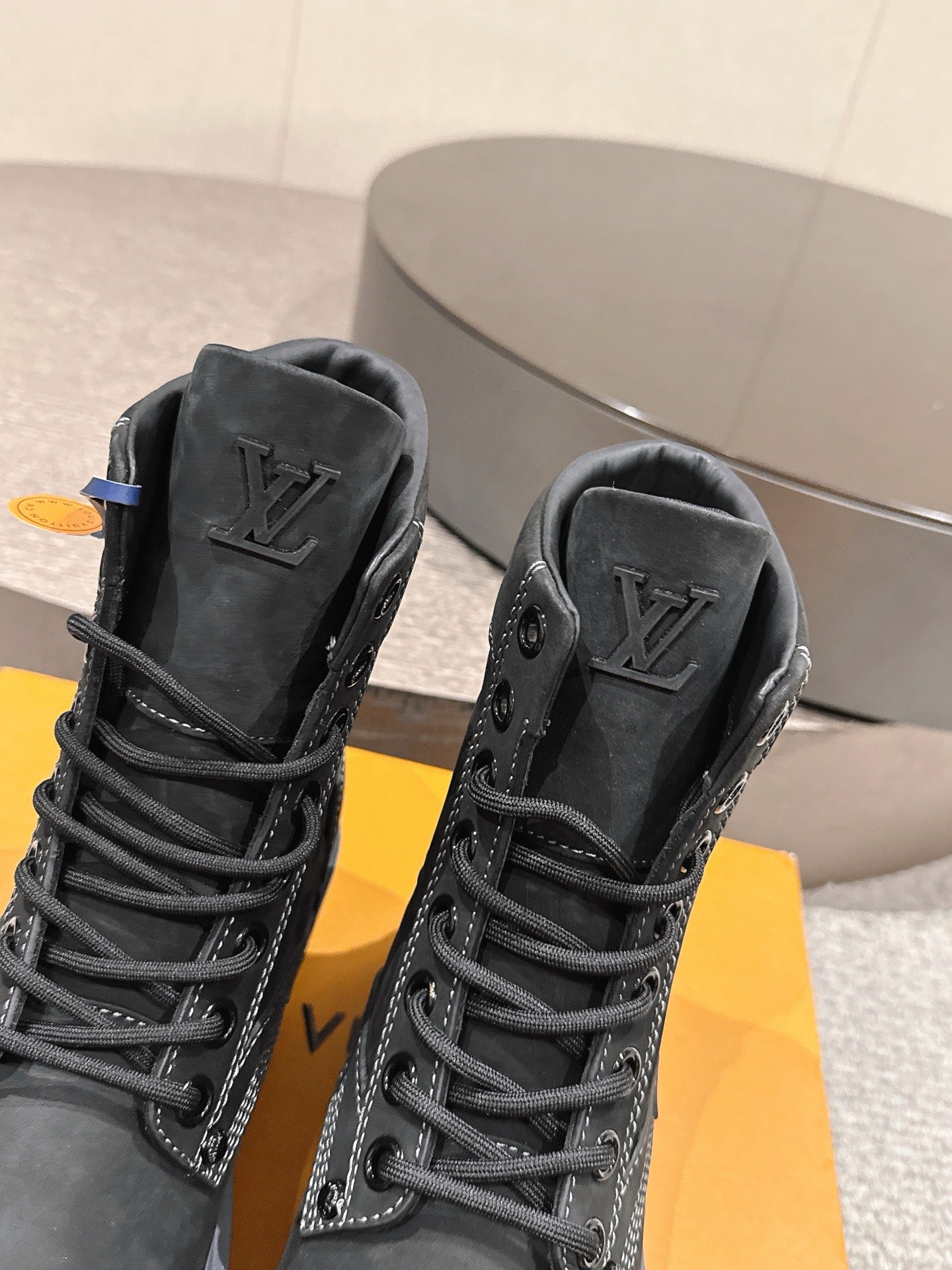 Louis Vuitton unisex black high-top boots, lace detail with LV emblem, rubber sole