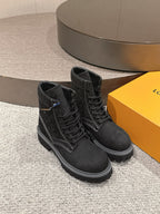 Louis Vuitton unisex black lace-up high-top boots, side view, padded collar, tread sole