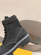 Black lace-up ankle boot with contrast stitching and padded collar